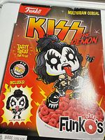 Front of KISS The Demon Funko’s cereal box showing artwork and FYE exclusive badge
