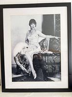 Full view of framed Louise Brooks poster showing frame, mat, and image