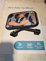 Front of retail box displaying mirror, product name, icons