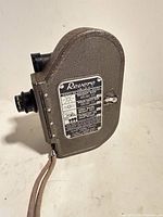 Left side view showing exposure guide plate, body texture, wrist strap