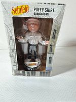 Front view of boxed Seinfeld Puffy Shirt bobblehead