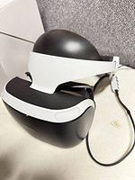 Front and top view of Sony PSVR headset showing exterior condition and attached cable