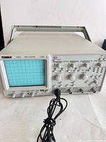 Front view of Tenma 72-6820 oscilloscope displaying CRT screen and controls