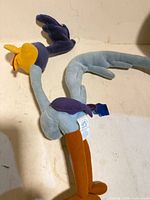 Full view of Road Runner plush showing body and tag