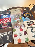 Tabletop view of 12 LP jackets showing artists and titles