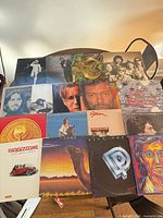 Overall lot showing 16 vinyl LP record jackets on tabletop