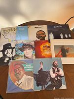 Group shot showing all eight album covers