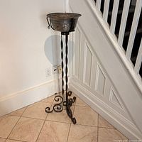 Full view of stand showing twisted stem, scroll feet and bowl