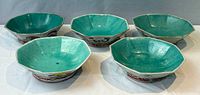 Five larger octagonal bowls showing turquoise interiors