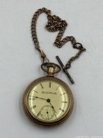 Front view of pocket watch with attached chain