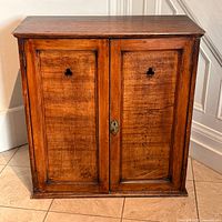 front view of antique wood cabinet with two doors