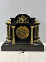 Front view showing gilt bronze mounts, columns, dial and key