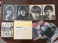 Front view showing test pressing envelope, four portraits, group photo, master sheet, magazines and Lennon photo