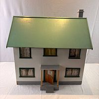 front view of painted wooden dollhouse