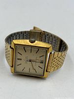 Front view showing square dial, markers, date window