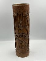 Full front view of carved bamboo brush pot