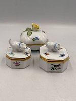 Three Herend trinket boxes showing lids and decoration