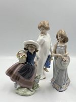 Front view of all three porcelain figurines