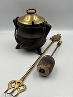 Pot with lid, pumice wand and fork poker grouped