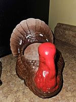 Top view of brown ceramic rooster planter showing open cavity