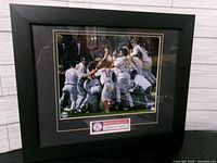 Full view of framed Boston Red Sox 2004 World Series Champions photo