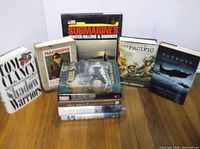 Group shot of all 10 books standing and stacked