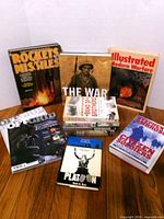 Group shot of all books upright and stacked