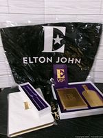 Set showing tote, lanyard, notebook, boxed passport holder and luggage tag