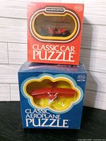 Both boxed puzzles stacked