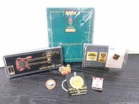 Overall group of pins with Atlanta 1996 presentation folder