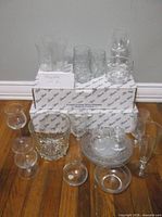 assorted Princess House glassware displayed with original boxes