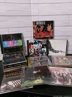 Group shot of all CD cases standing and laid flat