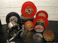 Overall lot showing Penn reel and six line spools
