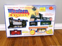 Front of boxed Western Express 33-piece electronic train set showing contents and features