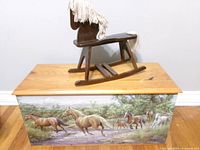 Chest with rocking horse on lid, showing horse artwork