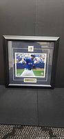 Front view showing framed David Price photo, mat, logo medallion, nameplate