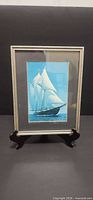 Front view of framed Bluenose II print on stand