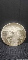 Front of glazed porcelain plate showing Mount Rushmore image