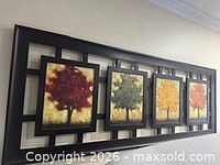 Front view of connected 4-panel wall art showing black frame and tree images