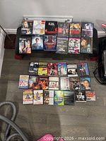 Overhead of cases laid out and stacked, shows mix of titles and formats