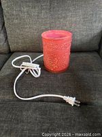 Embossed coral pink glass wax warmer with power cord and plug