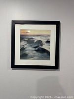 First framed seascape print on wall