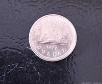 Reverse side showing CANADA, DOLLAR, 1977 inscription