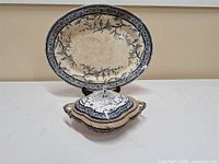 Platter standing behind covered dish showing patterns and shapes