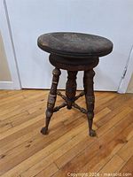 Full view of antique piano stool