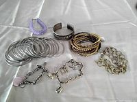 All bracelets laid out on cloth surface