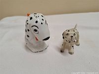 Front view of both Dalmatian figurines