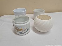 All four ceramic pots grouped