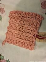 Full view of crocheted wool hot pad front