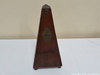 Full view of wooden pyramid metronome